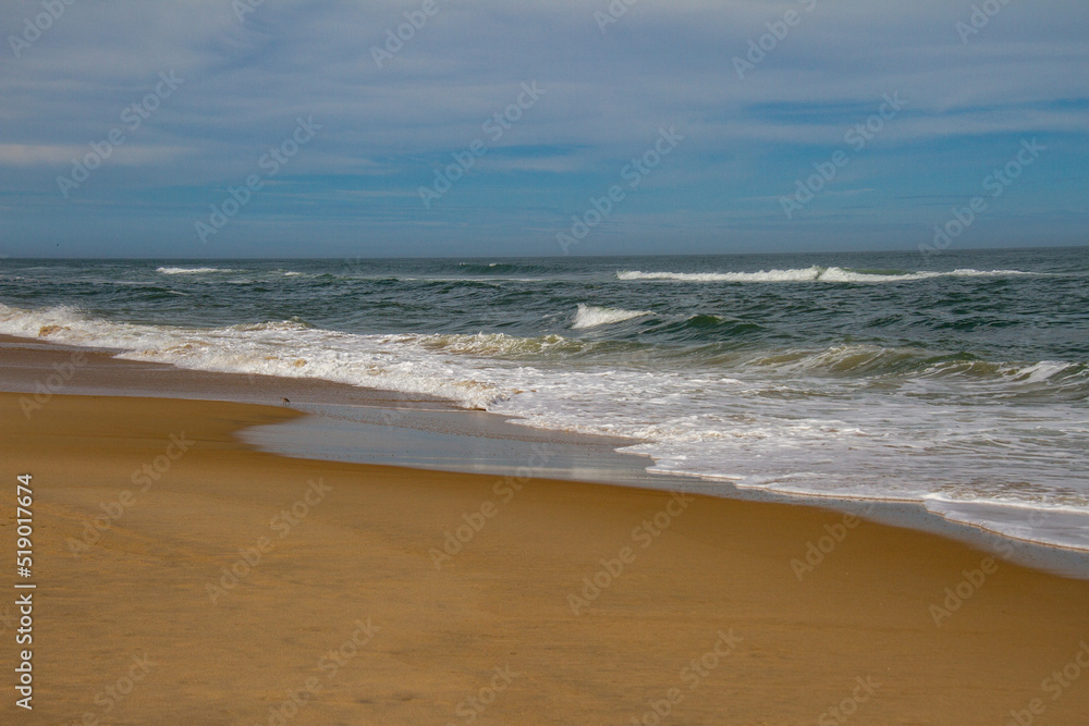 waves crashing into the beach in the morning in the Outer Banks, North Carolina