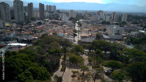 Aerial view of Taubate from Santa Terezinha square, with the mantiqueira mountain range in the background, on a sunny afternoon in winter © JP CARNEVALLI