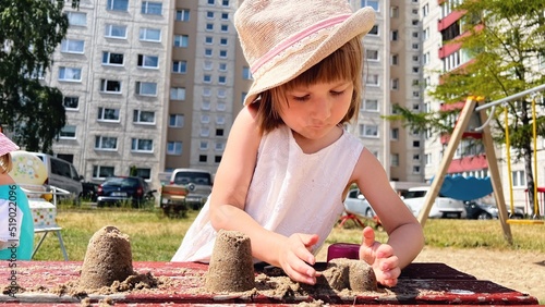 Wallpaper Mural SMALL GIRL playing at playground at backyard of blocks of flats Torontodigital.ca