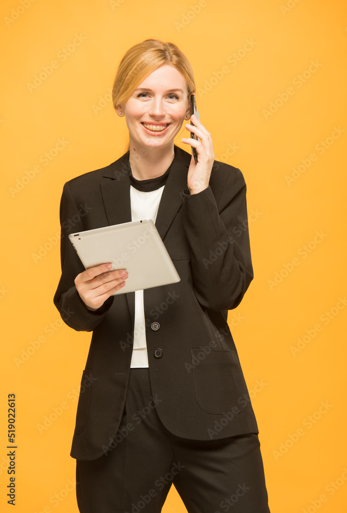girl uses tablet and phone.portrait of young girl business lady with tablet and smartphone isolated.does online shopping business banking videoconference girl uses tablet and phone.portrait of young girl business lady with tablet and smartphone isolated.does online shopping business banking videoconference
