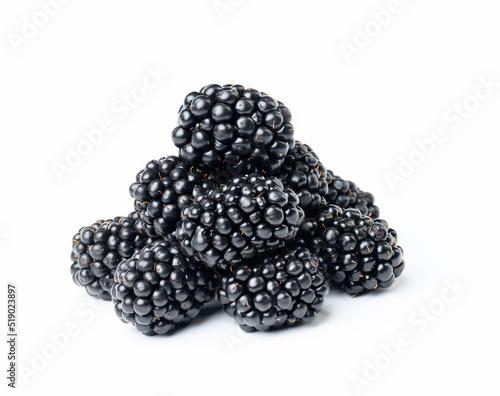A bunch of ripe blackberries on a white isolated background