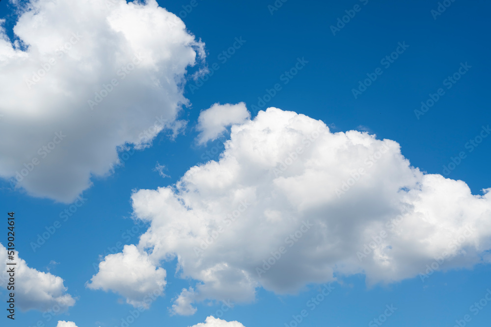 Fototapeta premium Sunny blue sky with clouds. Clouds move smoothly across the sky