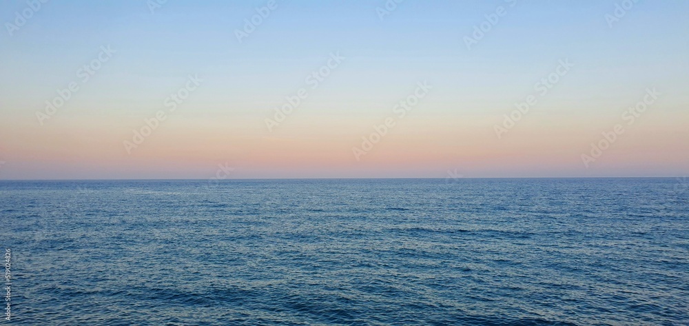 Gentle beautiful sunset on the sea in Spain. Vanilla sunset in Spain. Sea and sunset in Torrevieja. Calm on the sea. Beautiful calm and sunset. Rest on the sea.