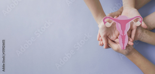 Vászonkép Hands holding uterus, female reproductive system , woman health, PCOS, gynecolog