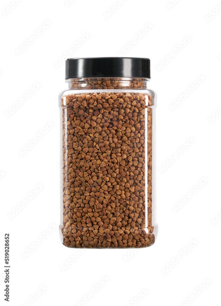 plastic jar with uncooked buckwheat isolated on white background. plastic jar with uncooked buckwheat isolated on white background.