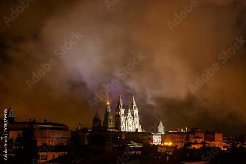 View of facede of Cathedral of Santiago with strong night fog