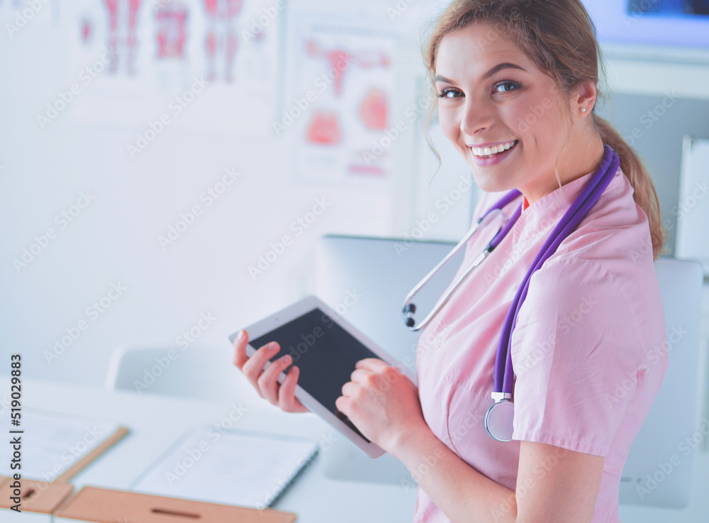 beautiful female healthcare worker using tablet computer in hospital beautiful female healthcare worker using tablet computer in hospital