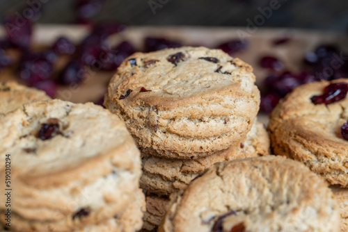 delicious dried cookies made of high-quality flour with dried red cranberries on the table