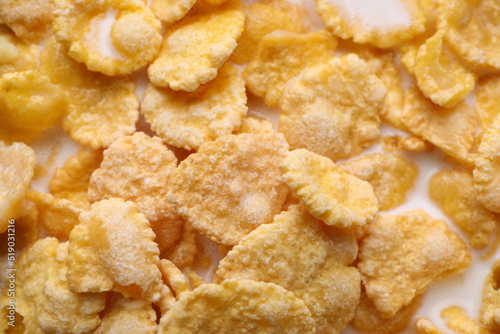 Tasty cornflakes with milk as background, closeup Tasty cornflakes with milk as background, closeup