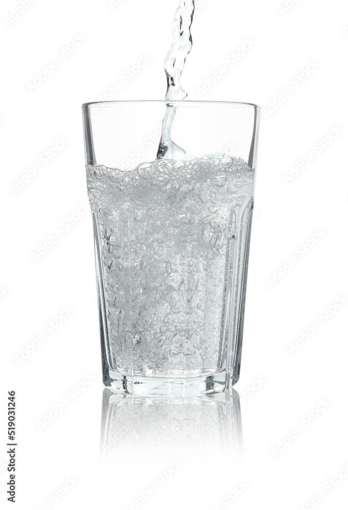 Pouring soda water into glass on white background Pouring soda water into glass on white background