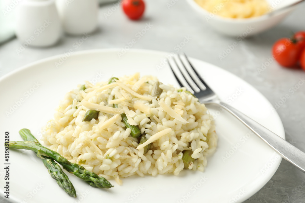 Delicious risotto with asparagus in plate, closeup Delicious risotto with asparagus in plate, closeup