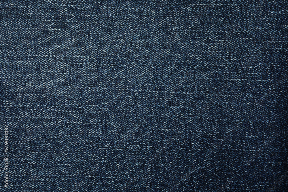Texture of dark blue jeans as background, closeup Texture of dark blue jeans as background, closeup