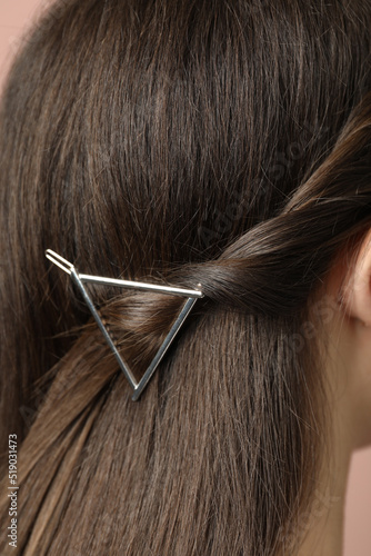 Young woman with beautiful hair clip, closeup