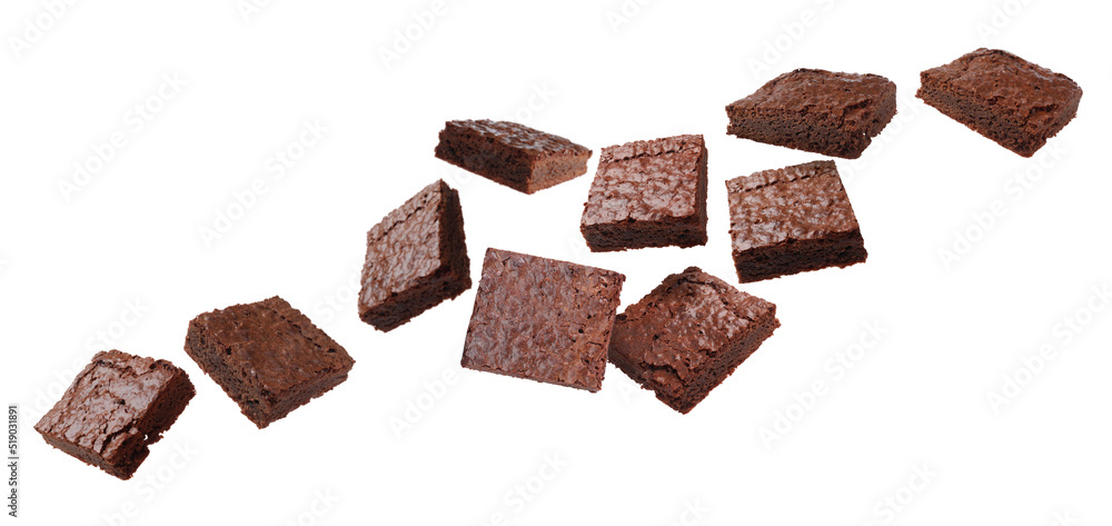 Slices of delicious chocolate brownie flying on white background. Banner design