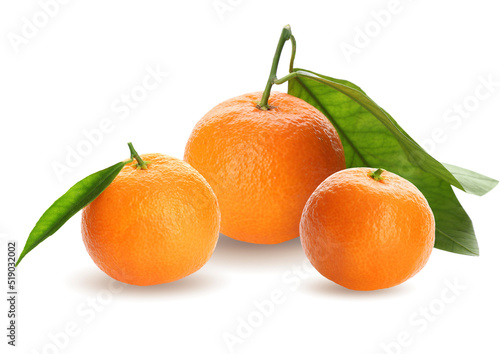 Tasty ripe tangerines and green leaves on white background