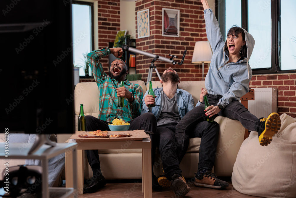 Obraz premium Sport supporters celebrating football match victory, feeling happy about team scoring goal and winning soccer game tournament. Group of fans enjoying championship win, drinking beer.