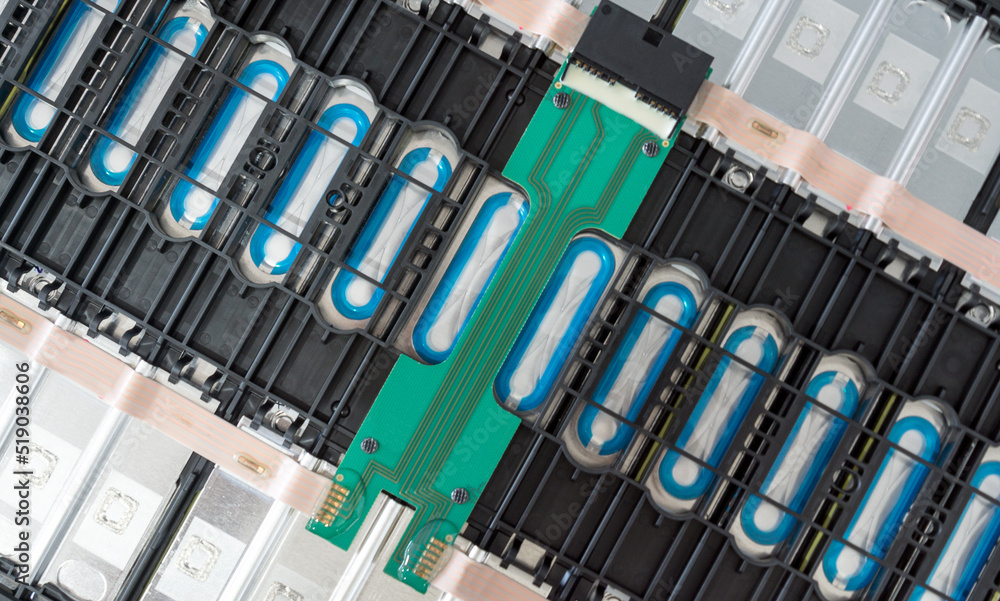 Selective focus of Electric car lithium battery pack and wiring connections internal between cells on background.	