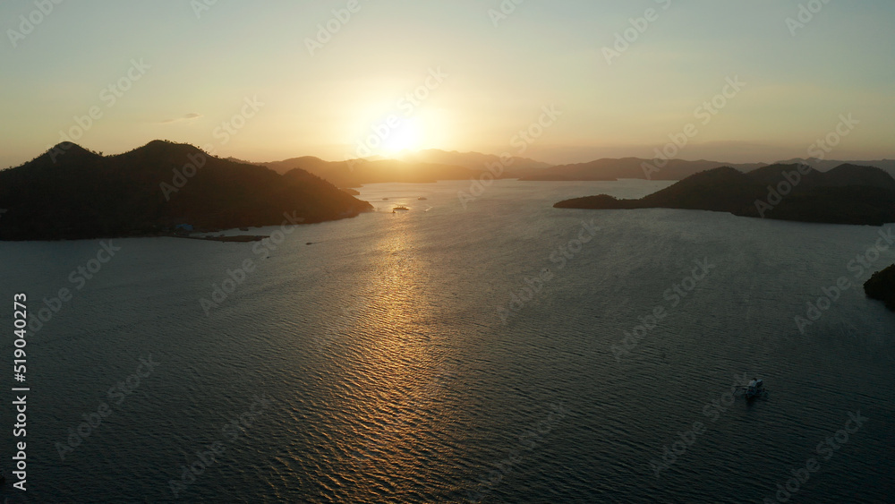 aerial view Sea bay with boats at sunset. Sunset over the sea with islands. Philippine Islands in the evening. Busuanga, Palawan, Philippines