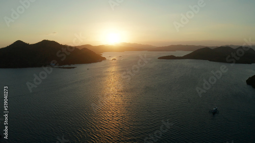 aerial view Sea bay with boats at sunset. Sunset over the sea with islands. Philippine Islands in the evening. Busuanga, Palawan, Philippines © Alex Traveler