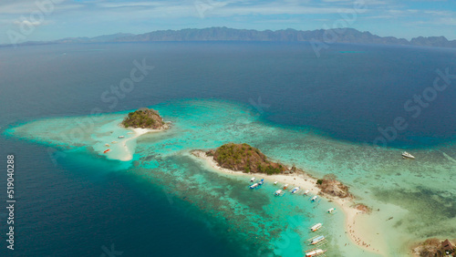 Fototapeta Naklejka Na Ścianę i Meble -  aerial view tropical island with sand white beach. Bulog Dos, Philippines, Palawan. Seascape bay with turquoise water and coral reef.