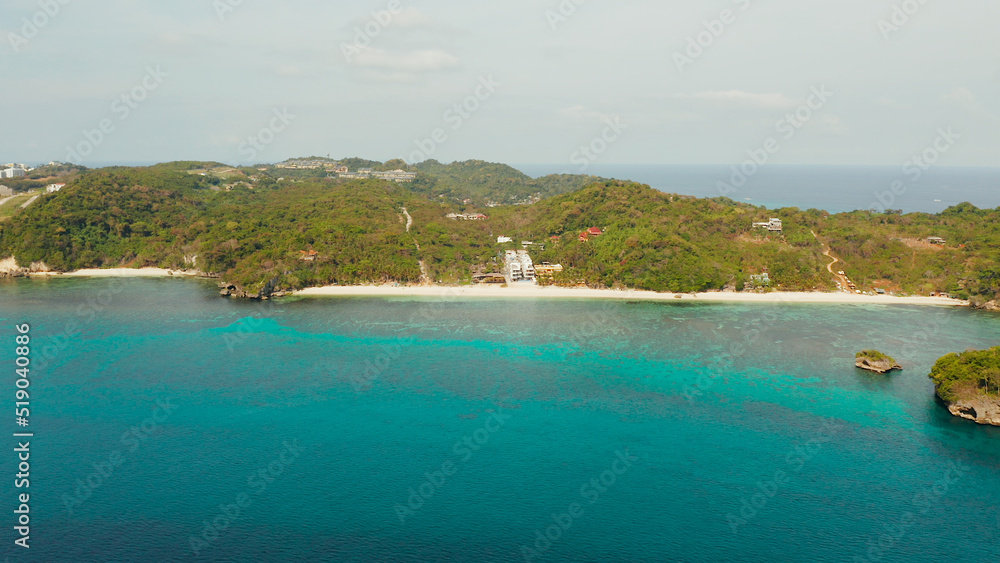 Tropical sandy beach near the blue lagoon and corall reef, aerial view Boracay, Philippines. Ilig Iligan Beach. Summer and travel vacation concept.