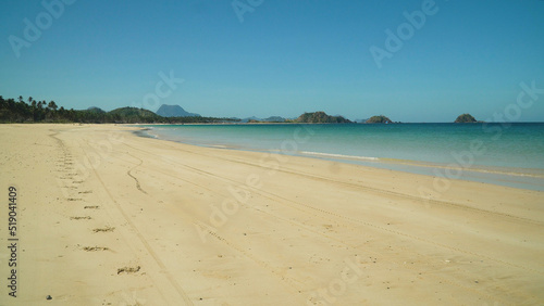 Tropical beach and blue sea against the blue sky. Nacpan  El Nido  Palawan  Philippines. Summer and travel vacation concept