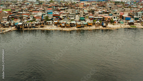 Slum area in Manila, Phillippines, top view. lot of garbage in the water. © Alex Traveler