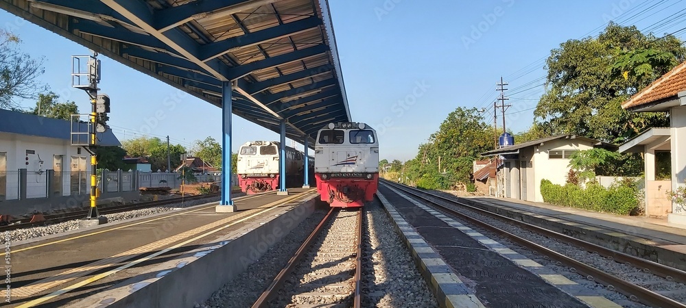 Naklejka premium Indonesian train passenger trains stop at one station