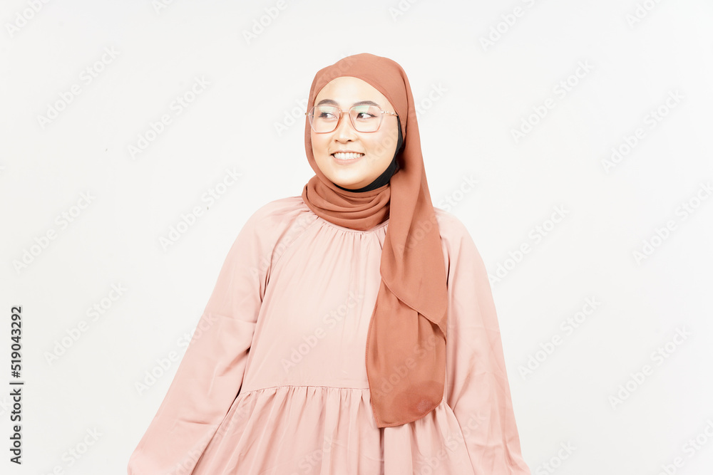 Smile and looking away of Beautiful Asian Woman Wearing Hijab Isolated On White Background Smile and looking away of Beautiful Asian Woman Wearing Hijab Isolated On White Background