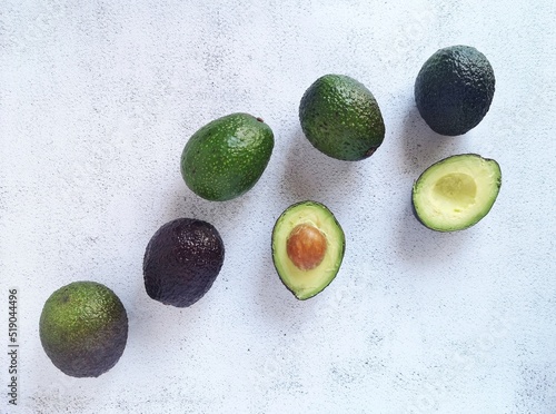 Avocados of varying degrees of maturity, top view