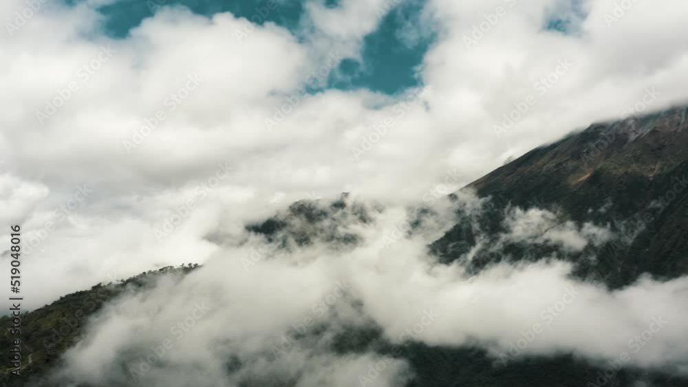 Clouds Around The Summit Of Tungurahua Volcano In The Cordillera Oriental Of Ecuador. pan right Clouds Around The Summit Of Tungurahua Volcano In The Cordillera Oriental Of Ecuador. pan right