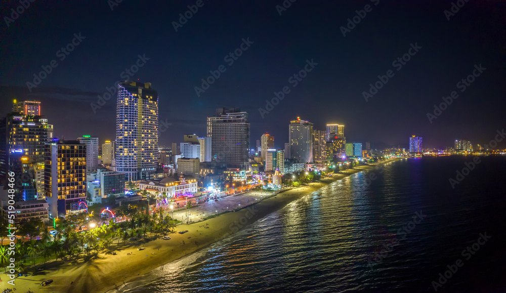 The coastal city of Nha Trang seen from above at night. This is a famous city for cultural tourism in central Vietnam The coastal city of Nha Trang seen from above at night. This is a famous city for cultural tourism in central Vietnam