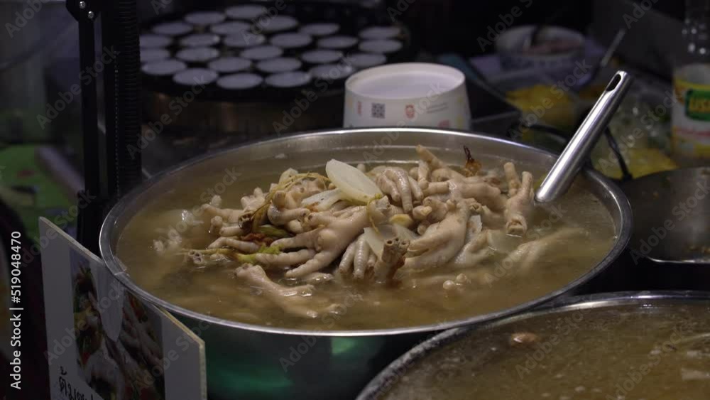 Spicy chicken feet soup on a big bowl , asian food, Close up Spicy chicken feet soup on a big bowl , asian food, Close up