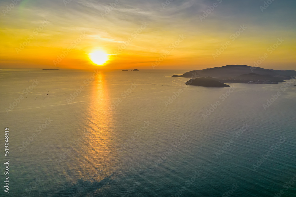 Aerial view of sunrise offshore as the sun rises to welcome a new day in the central coast of Vietnam