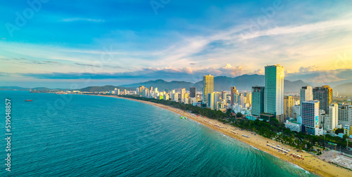 The coastal city of Nha Trang, Vietnam seen from above in the afternoon with its beautiful city and clean sandy beach attracts tourists to visit