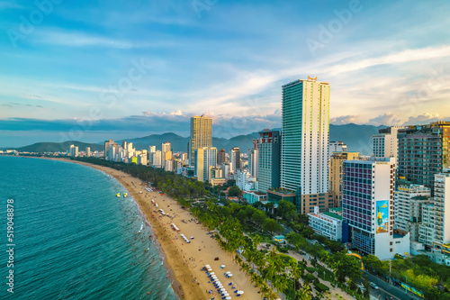 The coastal city of Nha Trang, Vietnam seen from above in the afternoon with its beautiful city and clean sandy beach attracts tourists to visit © huythoai