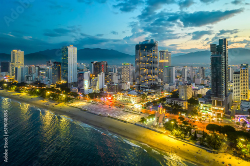 The coastal city of Nha Trang, Vietnam seen from above in the afternoon with its beautiful city and clean sandy beach attracts tourists to visit