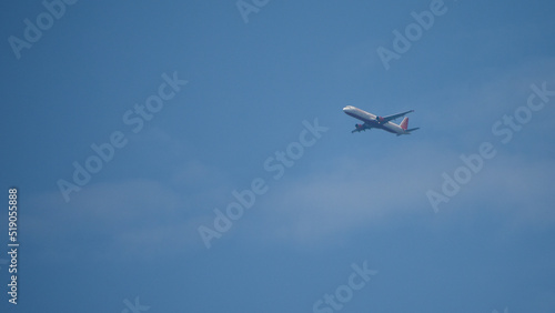 Air India flight flying in the blue sky.