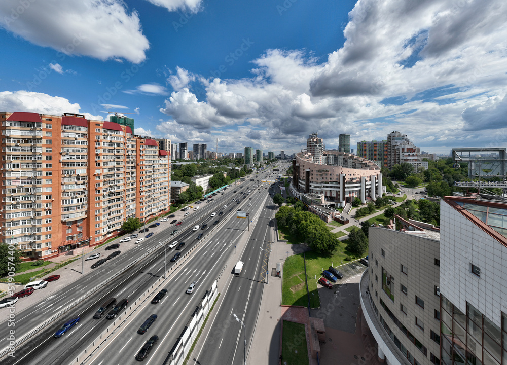 panoramic view of the cityscape with high-rise buildings, freeways and green parks on a sunny day taken from a drone panoramic view of the cityscape with high-rise buildings, freeways and green parks on a sunny day taken from a drone