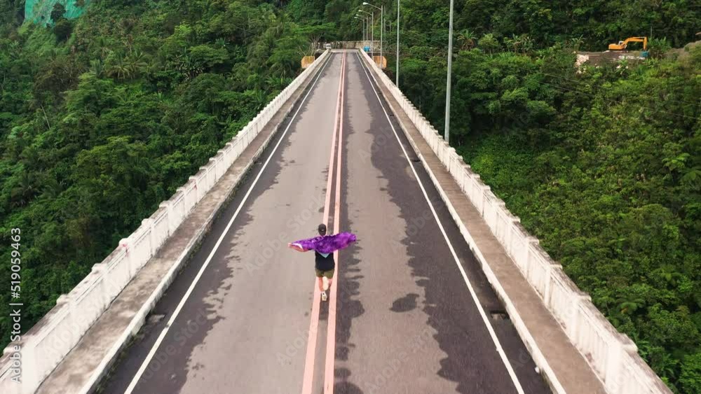 Tourist Man Running On AgasAgas Bridge In Southern Leyte, The