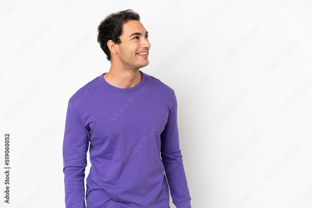 Caucasian handsome man over isolated white background thinking an idea while looking up Caucasian handsome man over isolated white background thinking an idea while looking up