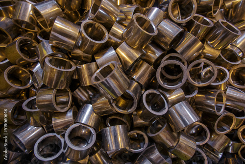 Closeup view of pressed copper powder bushings. photo