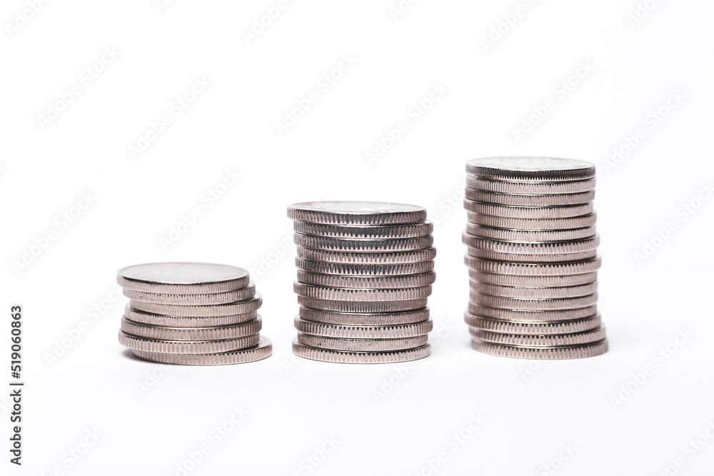 Three stacks of coins isolated on white background Three stacks of coins isolated on white background