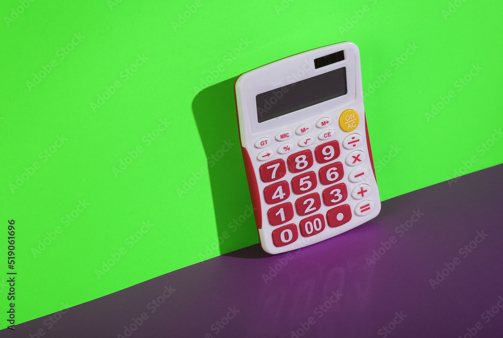 Modern calculator on a green-purple background. Creative layout Modern calculator on a green-purple background. Creative layout