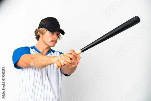 Young blonde man isolated on white background playing baseball