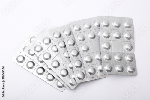 Metal blisters of pills on a white background