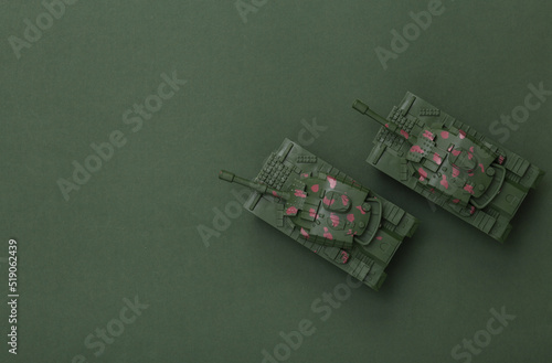 Two plastic tanks on a green background. Top view