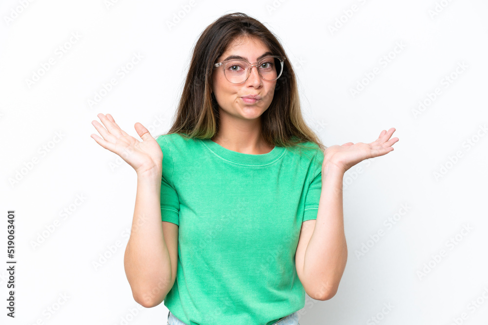 Young caucasian woman isolated on white background having doubts while raising hands Young caucasian woman isolated on white background having doubts while raising hands