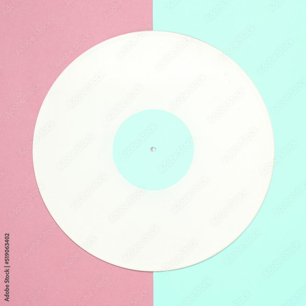 Music creative layout. White vinyl record on pink blue background. Top view. Flat lay Music creative layout. White vinyl record on pink blue background. Top view. Flat lay