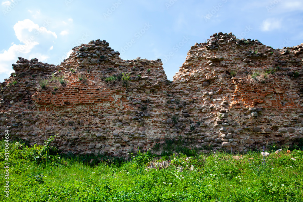 Ruins of an ancient fortress made of red bricks and stones